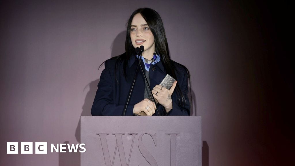 Billie Eilish accepting WSJ award on stage