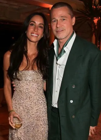Dave Benett/Getty Ines de Ramon (left) and Brad Pitt in June 2025