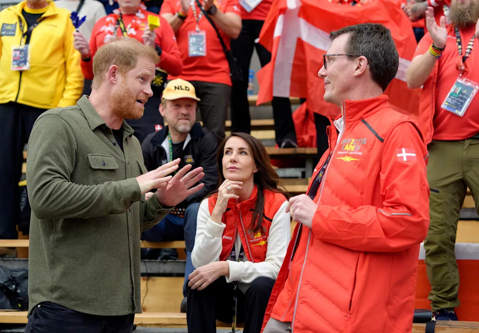 Prince Harry talking to Princess Marie and Prince Joachim of Denmark at the Invictus Games
