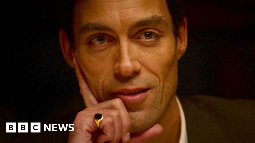 Watch: Jilly Cooper’s surprise cameo in hit TV series Rivals A man stares into the camera wearing a signet ring and his hand on his face