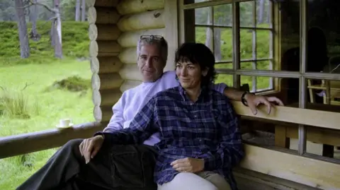 US Attorney's Office SDNY Epstein and Maxwell pictured sitting on a bench side by side at Balmoral in Scotland. 