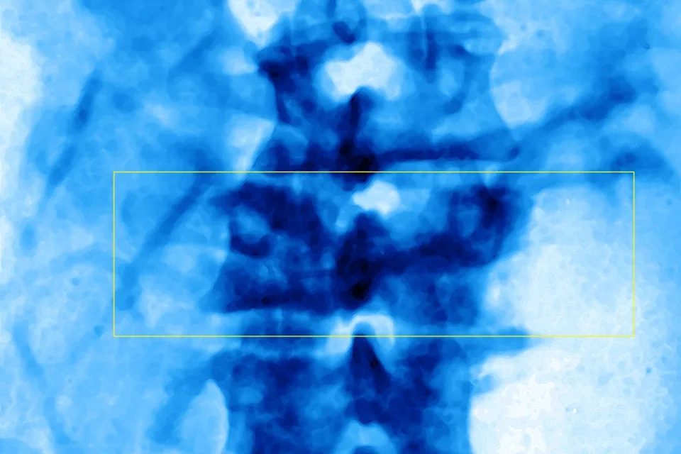 Abstract blue pattern with wispy shapes and a faint rectangular outline in the center