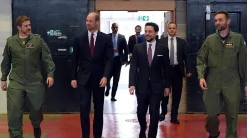 PA Media The Prince of Wales (2nd left) and the Crown Prince Hussein of Jordan (2nd right) during a visit to RAF Benson in Wallingford, Oxfordshire.