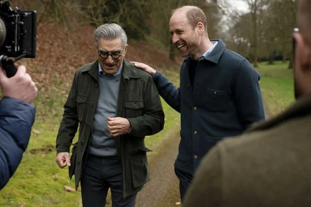 Ian Gavan/Apple TV+ Eugene Levy and Prince William in 'The Reluctant Traveler'