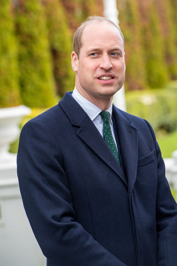 Prince William smiling in black coat