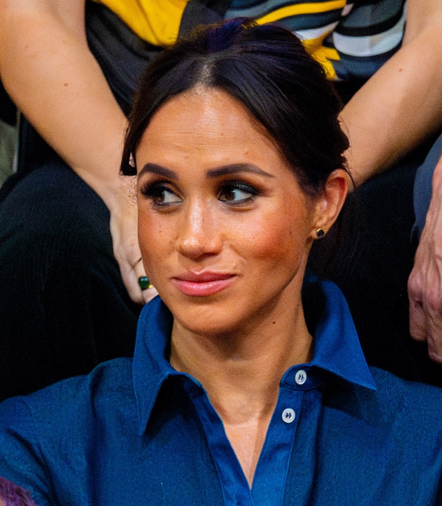 Meghan Markle wearing a blue shirt 