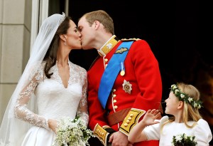 TRH Prince William, Duke of Cambridge and Catherine, Duchess of Cambridge kiss on the balcony of Buckingham Palace after getting married on April 29, 2011 in London, England. The marriage of the second in line to the British throne was led by the Archbishop of Canterbury and was attended by 1900 guests, including foreign Royal family members and heads of state. Thousands of well-wishers from around the world have also flocked to London to witness the spectacle and pageantry of the Royal Wedding.  (Photo by John Stillwell - WPA/Getty Images)
