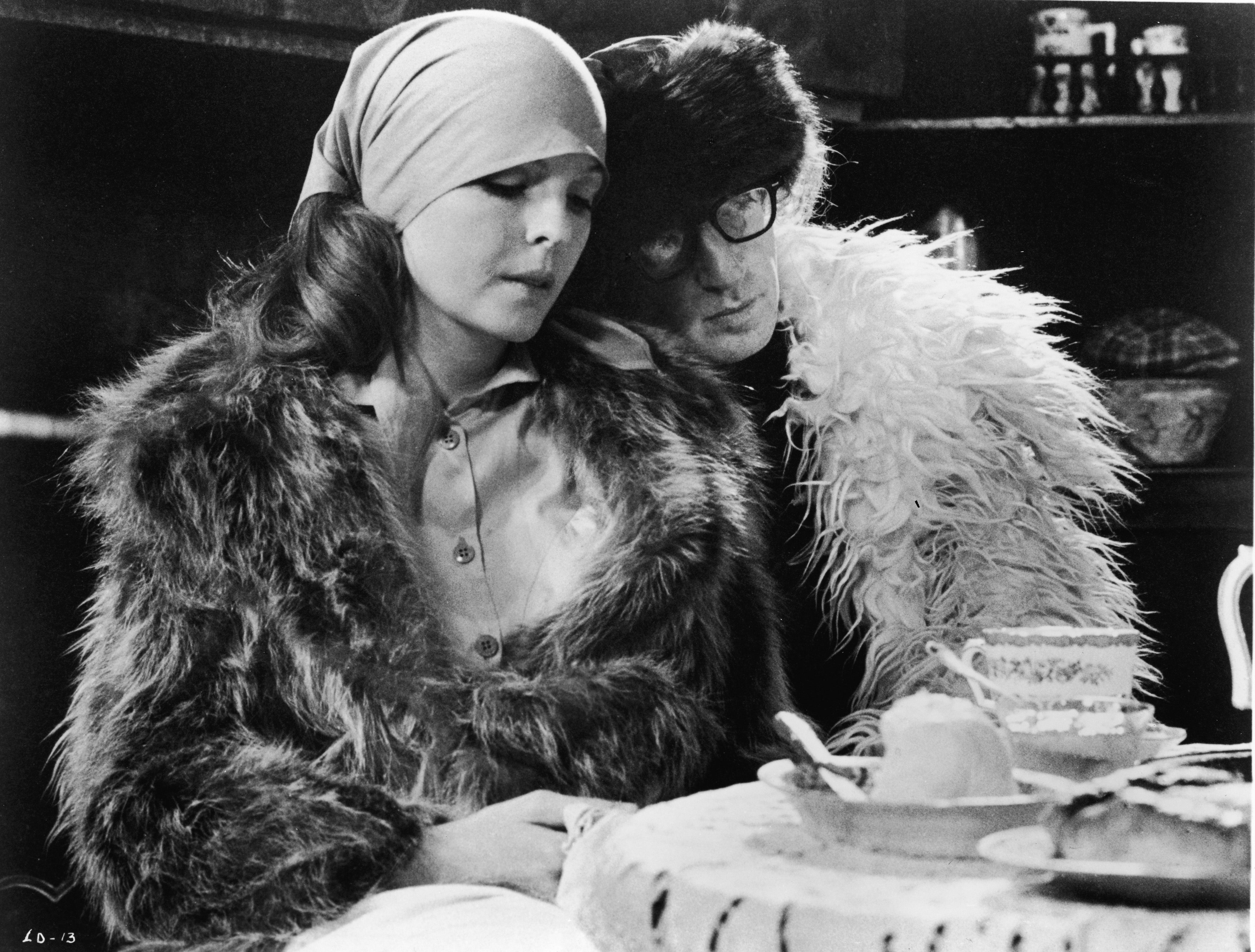 Woody Allen leans his head on the shoulder of Diane Keaton in a scene from 'Love and Death,' directed by Allen, 1975.