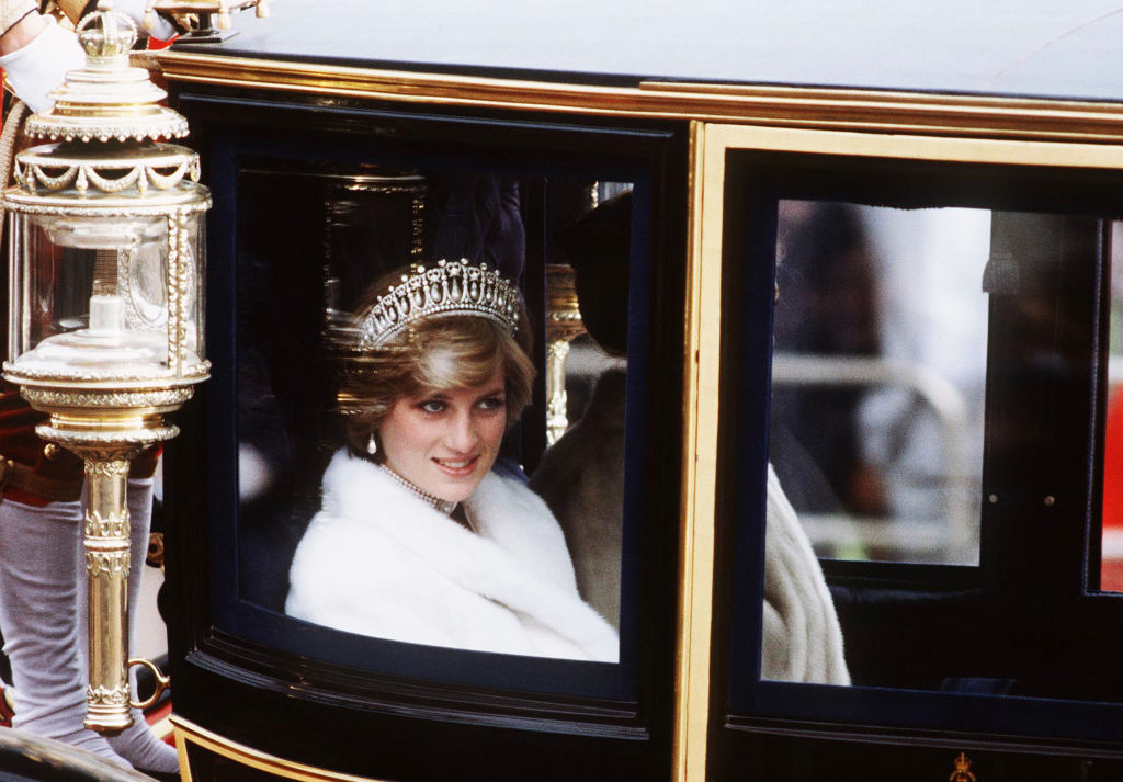 Princess Diana wearing the Cambridge Lover's Knot Tiara on her way to the State Opening of Parliament in 1981.