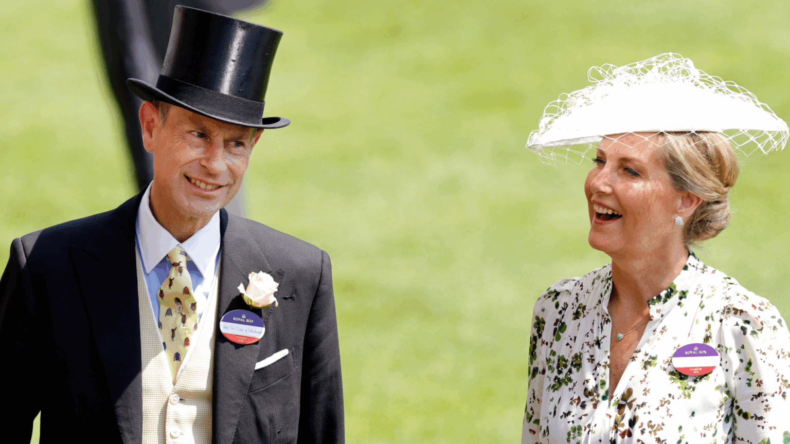 Duchess Sophie “Played a Trump Card” On Her First Date With Prince Edward Duchess Sophie wearing a white hat and floral dress and Prince Edward in a top hat and suit smiling at Royal Ascot