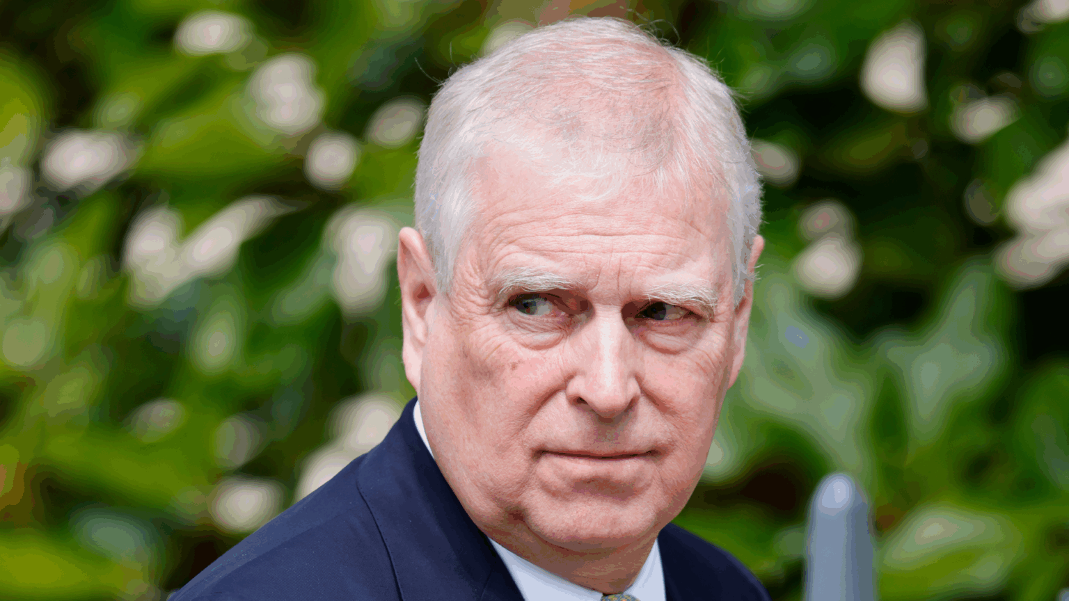 Former Prince Andrew “Thinks He’s Anointed” Prince Andrew wearing a blue suit and scowling