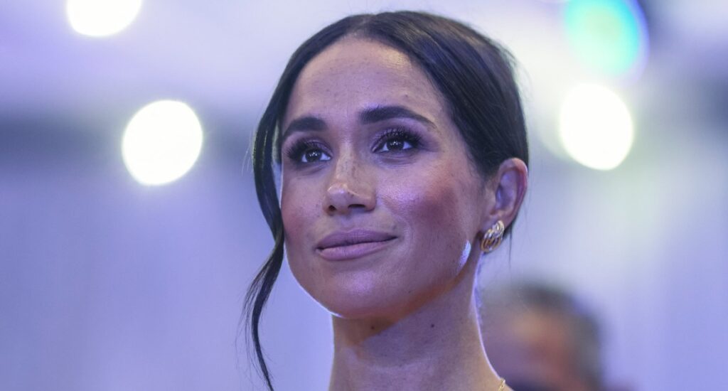 Camera Captures Eye-Catching Photo of a Coy Meghan Markle Camera Captures Eye-Catching Photo of a Coy Meghan Markle