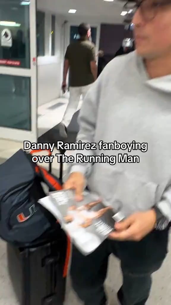 Danny Ramirez pretends to be a fan asking for Glen Powell’s autograph at the airport
