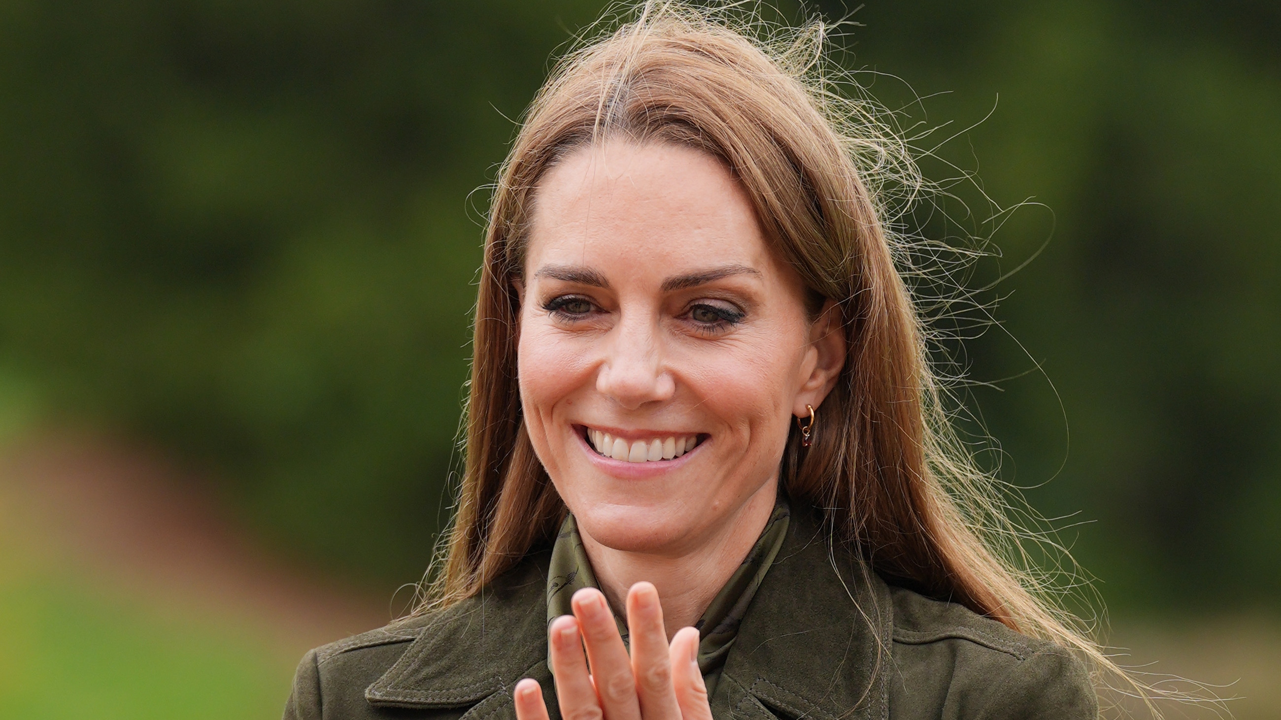 Catherine, Princess of Wales smiles and claps as she meets members of the Scouts' Squirrels programme