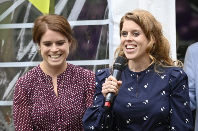Handout photo courtesy of Theo Wood of Princesses Beatrice and Eugenie addressing guests during a garden party at Haven House Children's Hospice, Woodford Green.