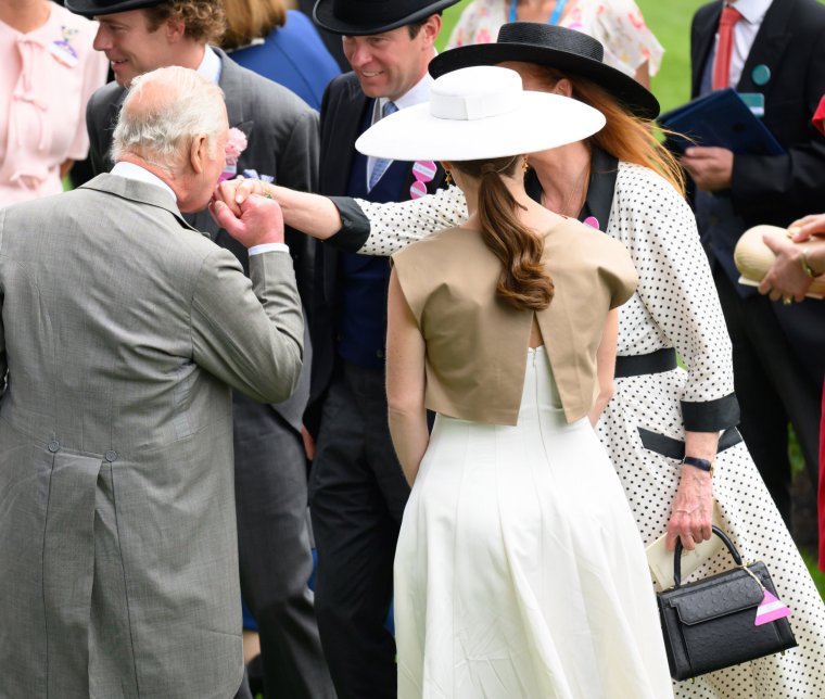 ASCOT, ENGLAND - JUNE 20: King Charles III kisses the hand of Sarah Ferguson, Duchess of York during day four of Royal Ascot at Ascot Racecourse on June 20, 2025 in Ascot, England. (Photo by Karwai Tang/WireImage)