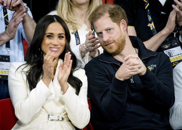 The Duke and Duchess of Sussex, Prince Harry and his wife Meghan Markle visit the sitting volleyball section of the fifth edition of the Invictus Games in The Hague on April 17, 2022. The Invictus Games is an international sporting event for servicemen and veterans who have been psychologically or physically injured in their military service. (Sem van der Wal/AFP/Getty Images/TNS)