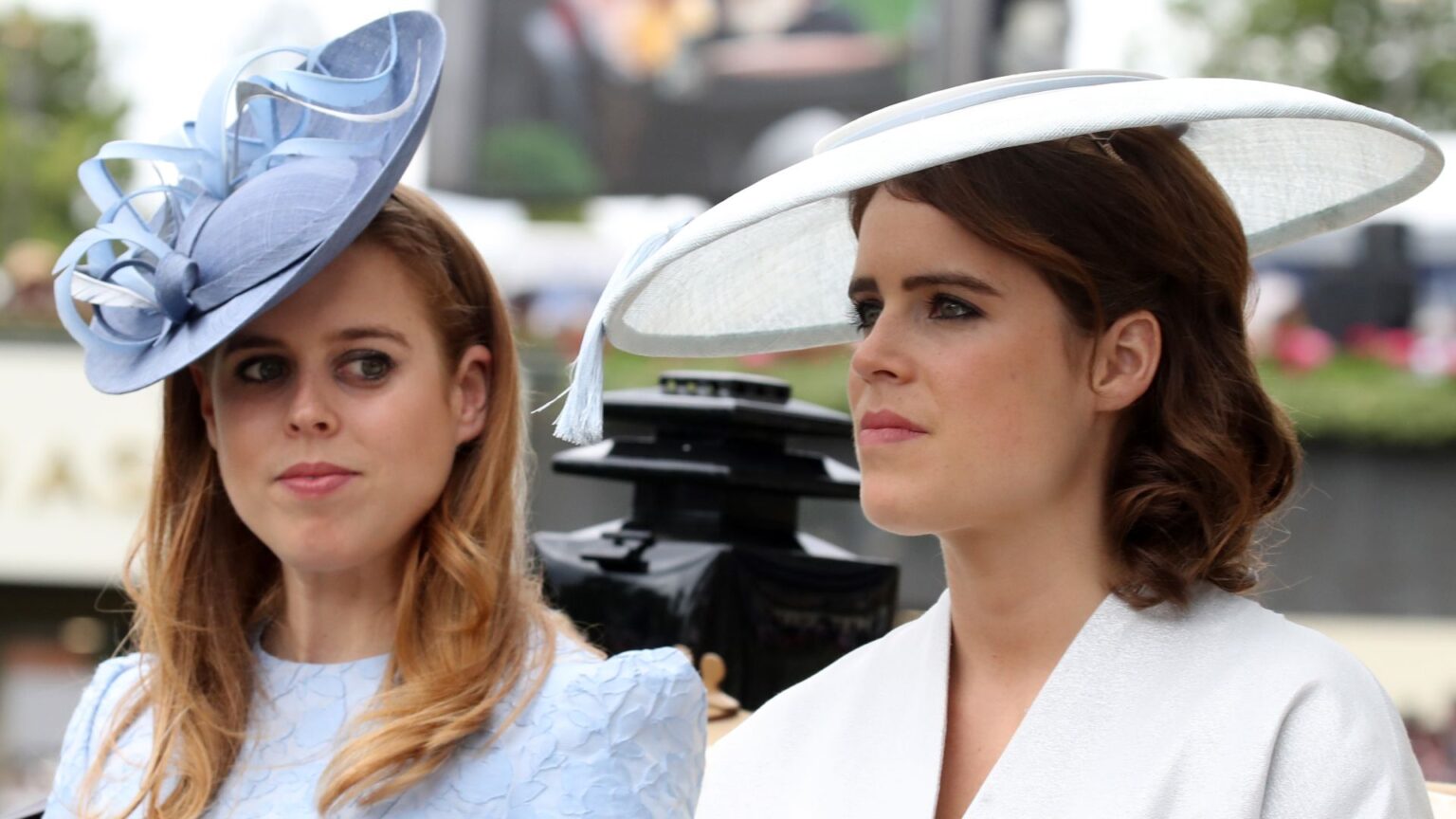 Are Eugenie and Beatrice Banned Alongside Dad Prince Andrew? Princess Beatrice wears a baby blue hat and dress and sister Princess Eugenie wears a white hat and matching jacket