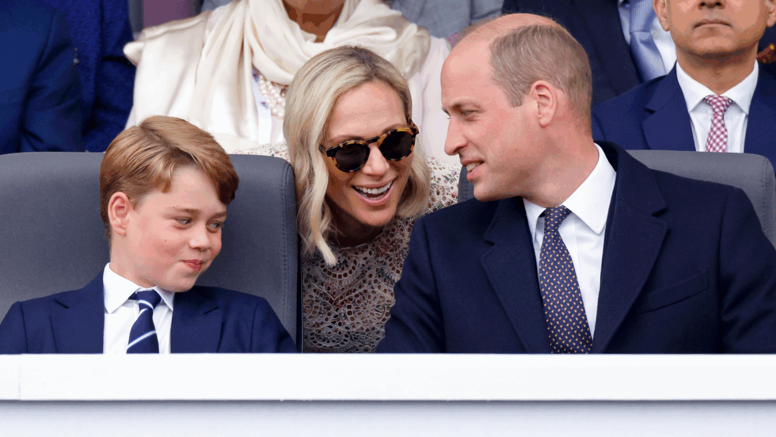 This Under-the-Radar Royal Serves as a “Tower of Strength and Support” for Future Kings Prince William and Prince George Prince George smirking as Zara Tindall leans over and talks to Prince William