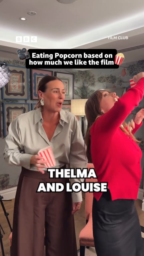 Suranne Jones and Aimee Lou Wood eating popcorn based on how much they like the film