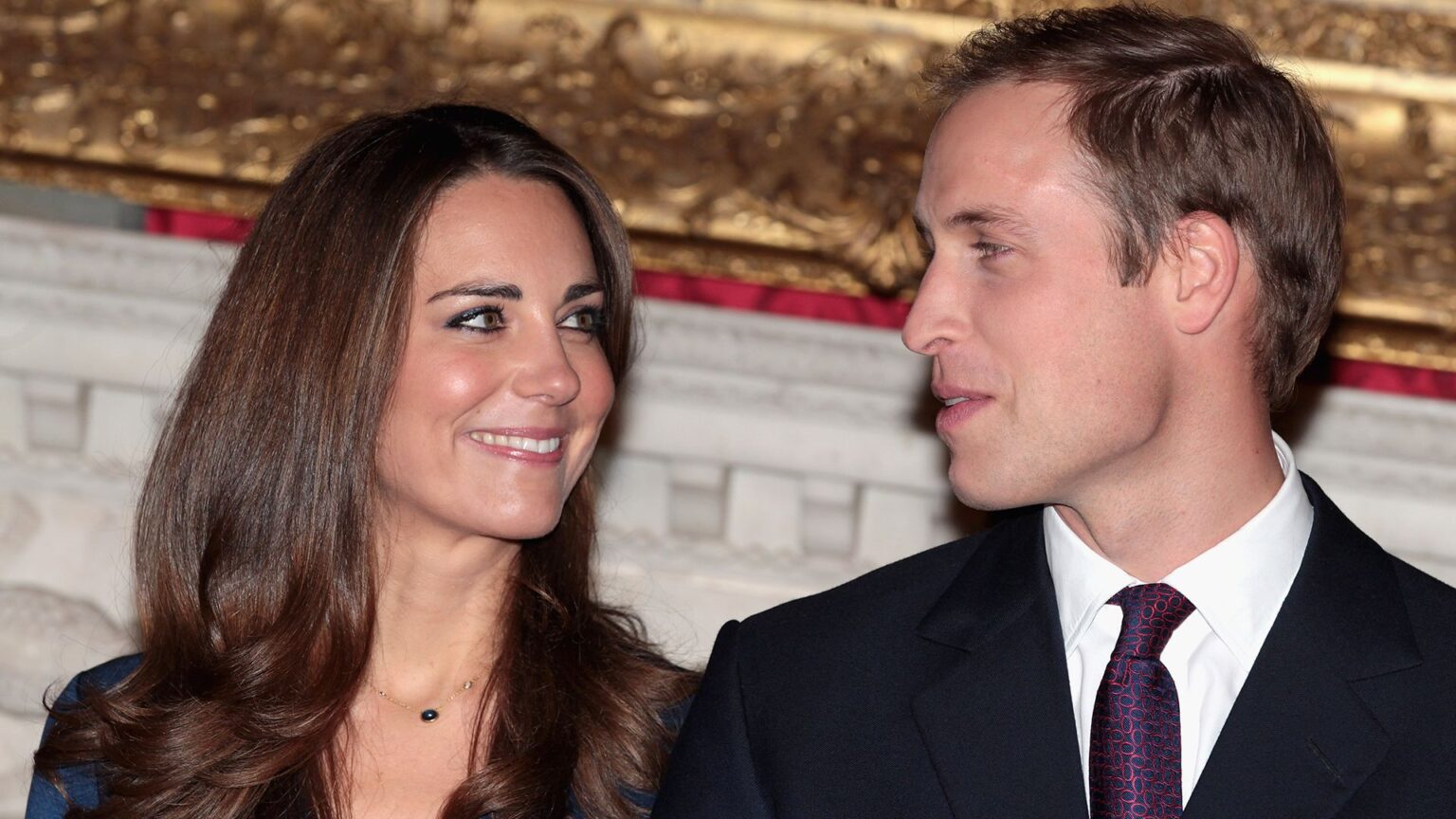 LONDON, ENGLAND - NOVEMBER 16: Prince William and Kate Middleton pose for photographs in the State Apartments of St James Palace on November 16, 2010 in London, England. After much speculation, Clarence House today announced the engagement of Prince William to Kate Middleton. The couple will get married in either the Spring or Summer of next year and continue to live in North Wales while Prince William works as an air sea rescue pilot for the RAF. The couple became engaged during a recent holiday in Kenya having been together for eight years. (Photo by Chris Jackson/Getty Images)