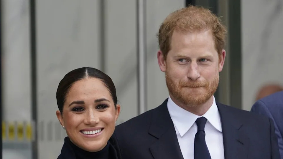 Meghan Markle and Prince Harry pose for pictures after visiting the observatory in One World Trade in New York, Sept. 23, 2021. (AP Photo/Seth Wenig, File)