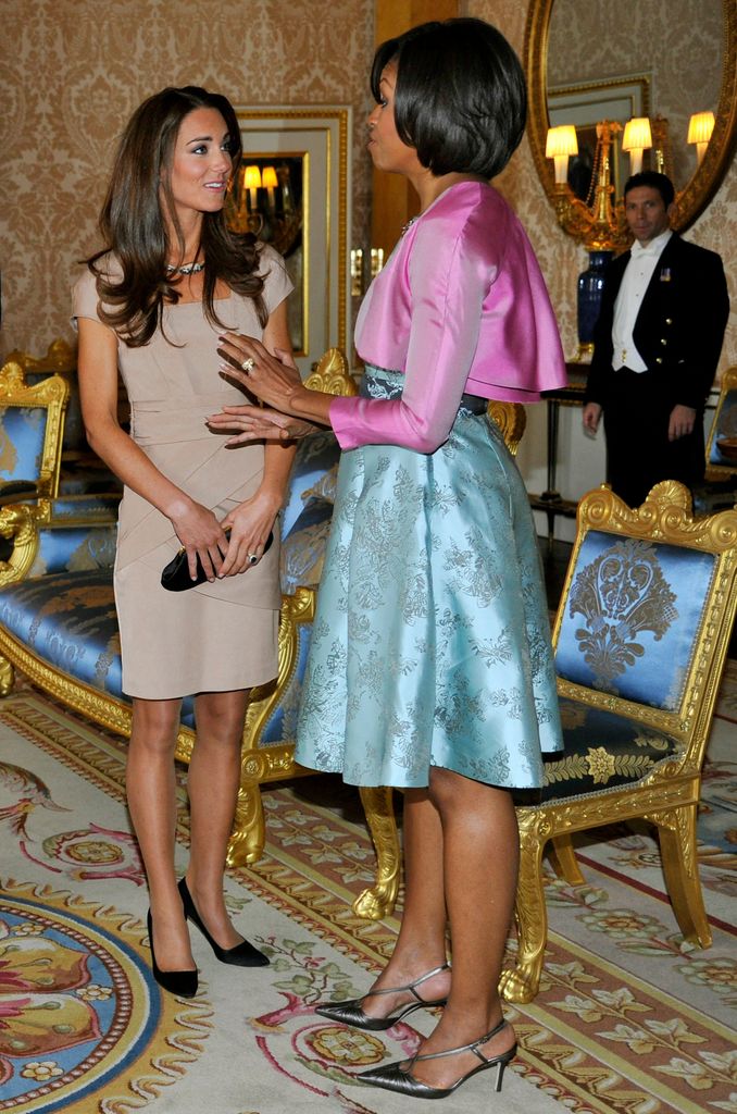 Kate Middleton with Michelle Obama wearing a 
 stone coloured Reiss dress at Buckingham Palace in London, on May 24, 2011. 