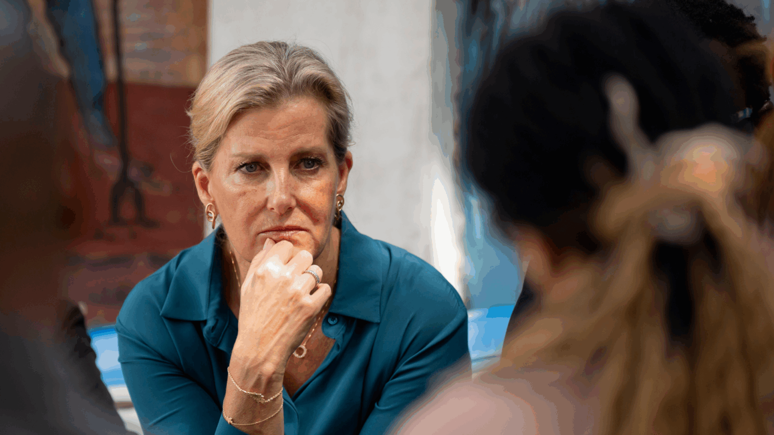 Duchess Sophie Hears Harrowing Stories of Rape Survivors in Democratic Republic of Congo Duchess sophie wearing a teal dress putting her hand on her chin and making a concerned look