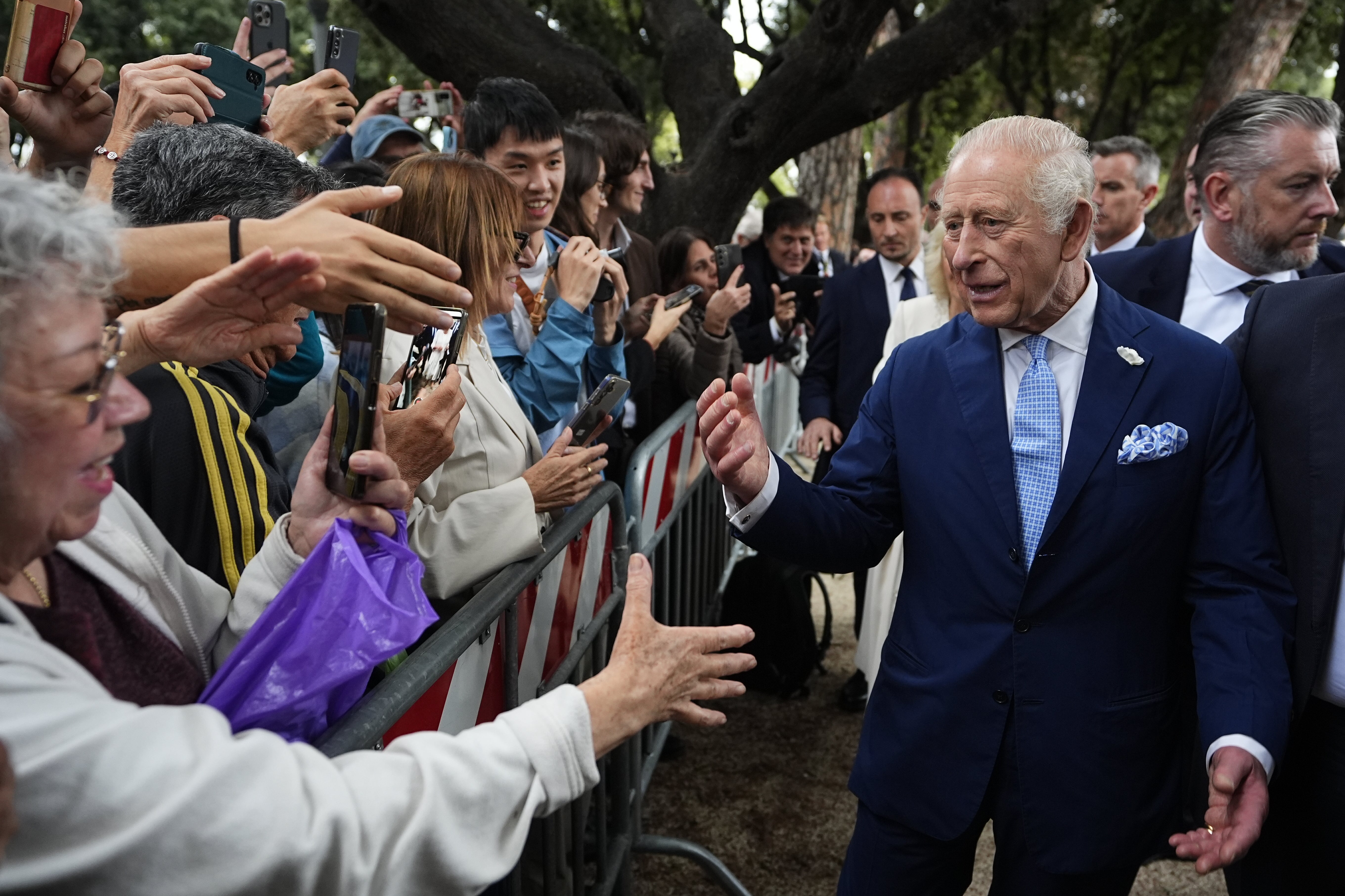 King Charles III, by far the richest British sovereign in modern times, meets members of the public outside the Papal Basilica (Aaron Chown/PA)
