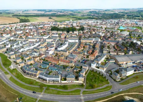 Getty Images An aerial view of the village of Poundbury, on the outskirts of Dorchester in Dorset. It is part of the Duchy of Cornwall, which passed to William when he succeeded his father as Prince of Wales when Charles became King. 