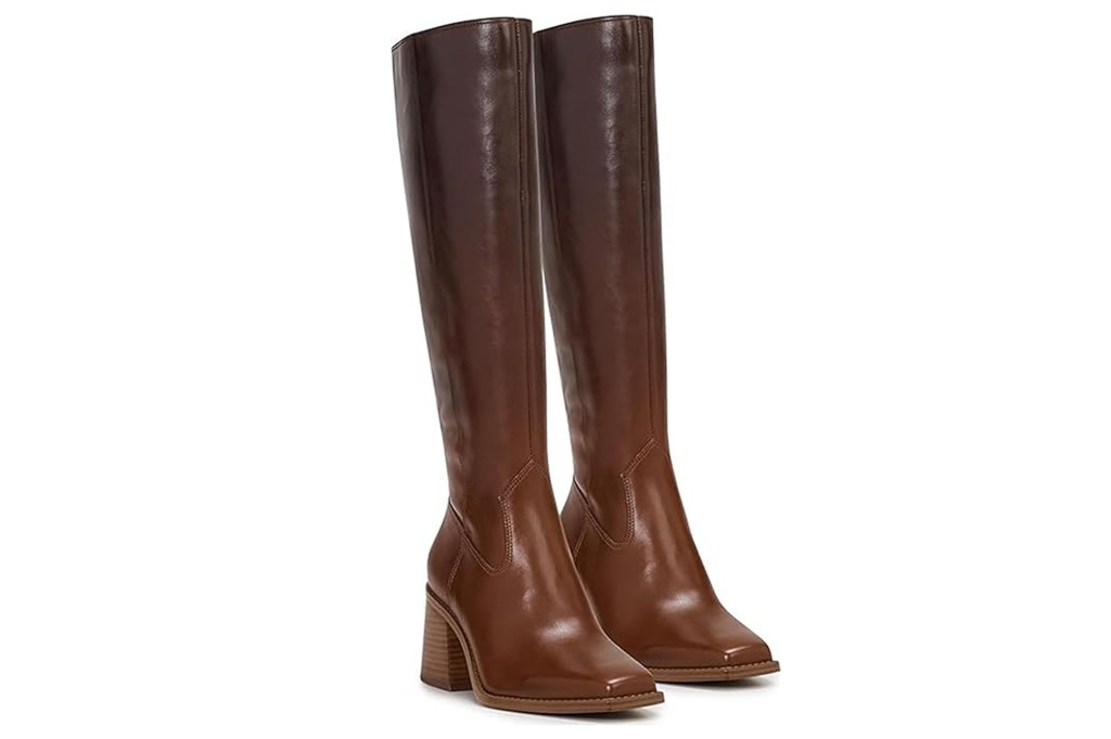 Pair of knee-high brown leather boots with chunky heels and square toes.