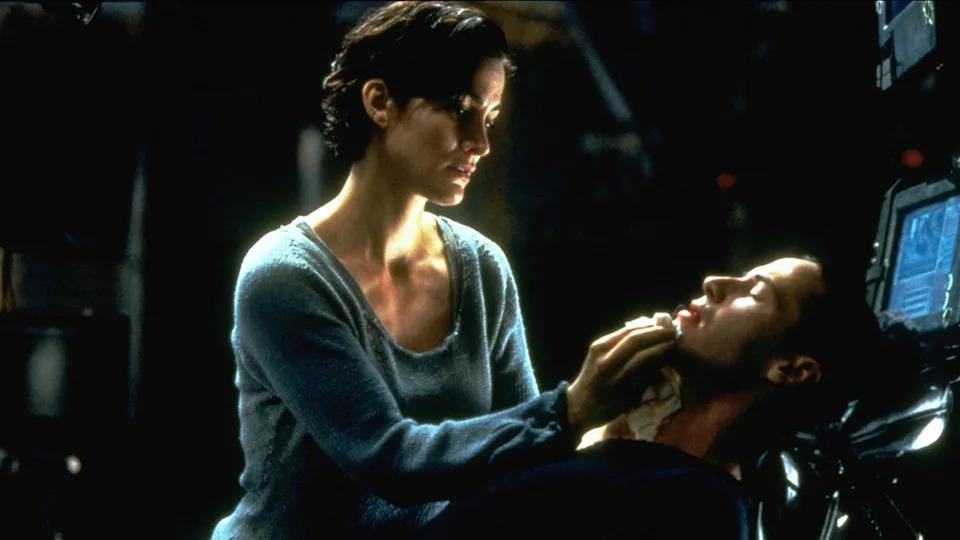 Carrie-Anne Moss and Keanu Reeves in a scene from "The Matrix"