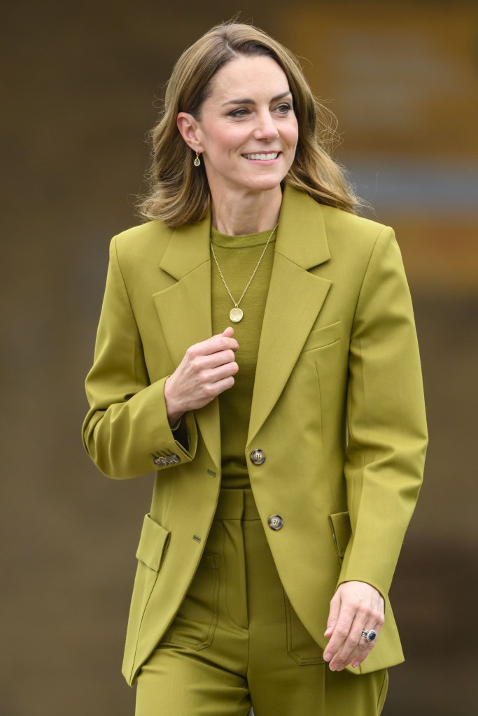 Kate Middleton in olive green suit during Oxford visit