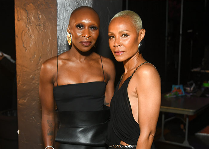 Two women posing together at an event, reflecting the strong reactions to Cynthia Erivo’s controversial Harper’s Bazaar shoot.