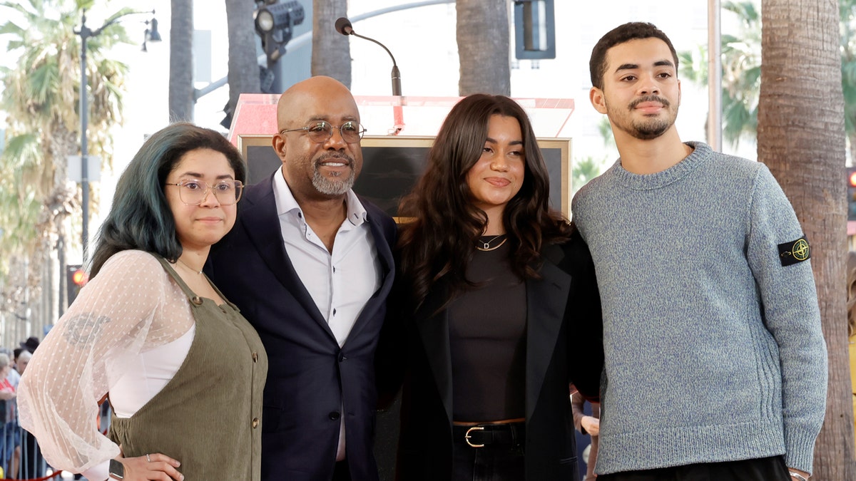 Darius Rucker poses with his three kids at his Hollywood Walk of Fame ceremony