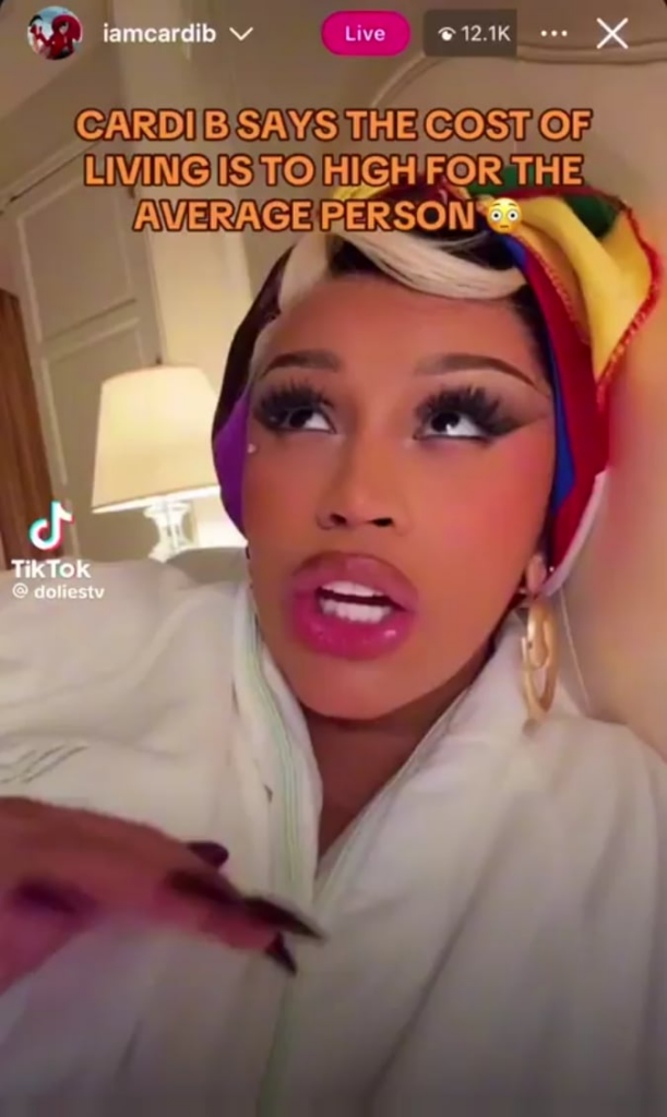 Cardi B apologizes to fans for asking them to buy her album after learning how much rent costs in New York City.