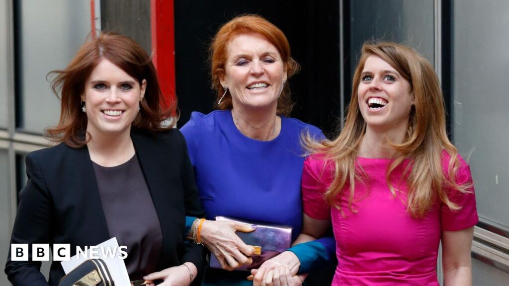 What’s next for Sarah Ferguson, Eugenie and Beatrice? Princess Beatrice, Sarah Ferguson and Princess Eugenie in dresses smile as they link arms walking