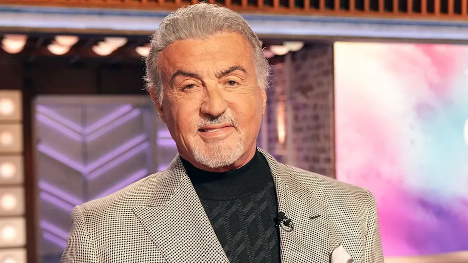 Sylvester Stallone in a black and white suit jacket while on The Kelly Clarkson Show in September 2025.