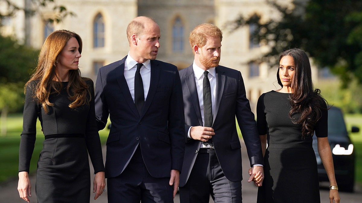 The Prince and Princess of Wales walking alongside the Duke and Duchess of Sussex in black attire.