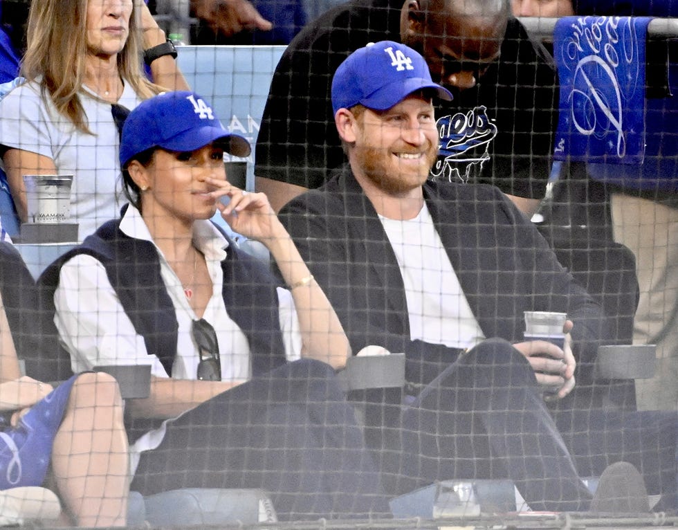 los angeles, ca october 28: prince harry and meghan markle look on in the second inning of game 4 of a world series baseball game between the toronto blue jays and los angeles dodgers at dodger stadium in los angeles on tuesday, october 28, 2025. (photo by keith birmingham/medianews group/pasadena star news via getty images)
