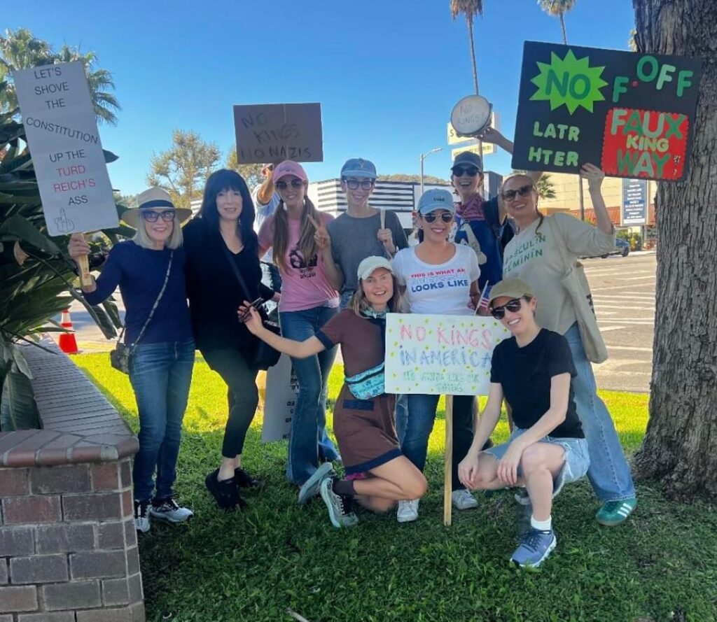 Anna Kendrick and Chrissie Fit, who starred in Pitch Perfect 2 And 3 together, at a 'No Kings' protest yesterday