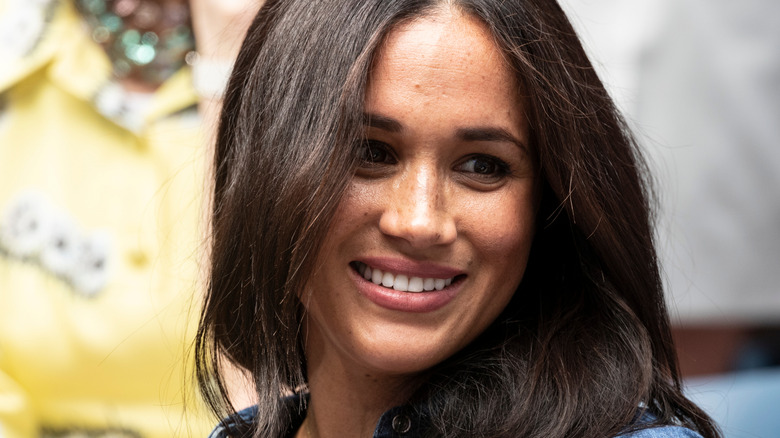 Meghan Markle smiles at the US Open Championship