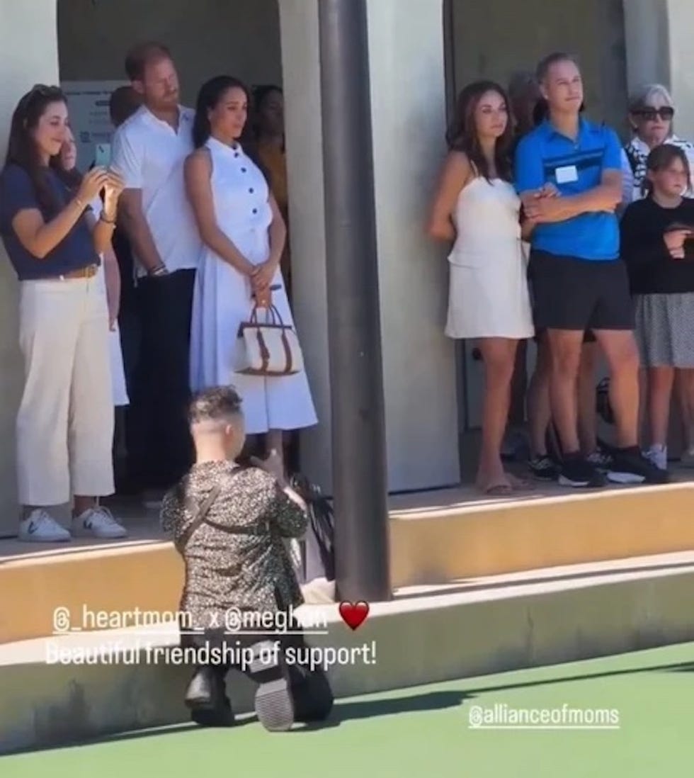 group of people standing on steps during an event