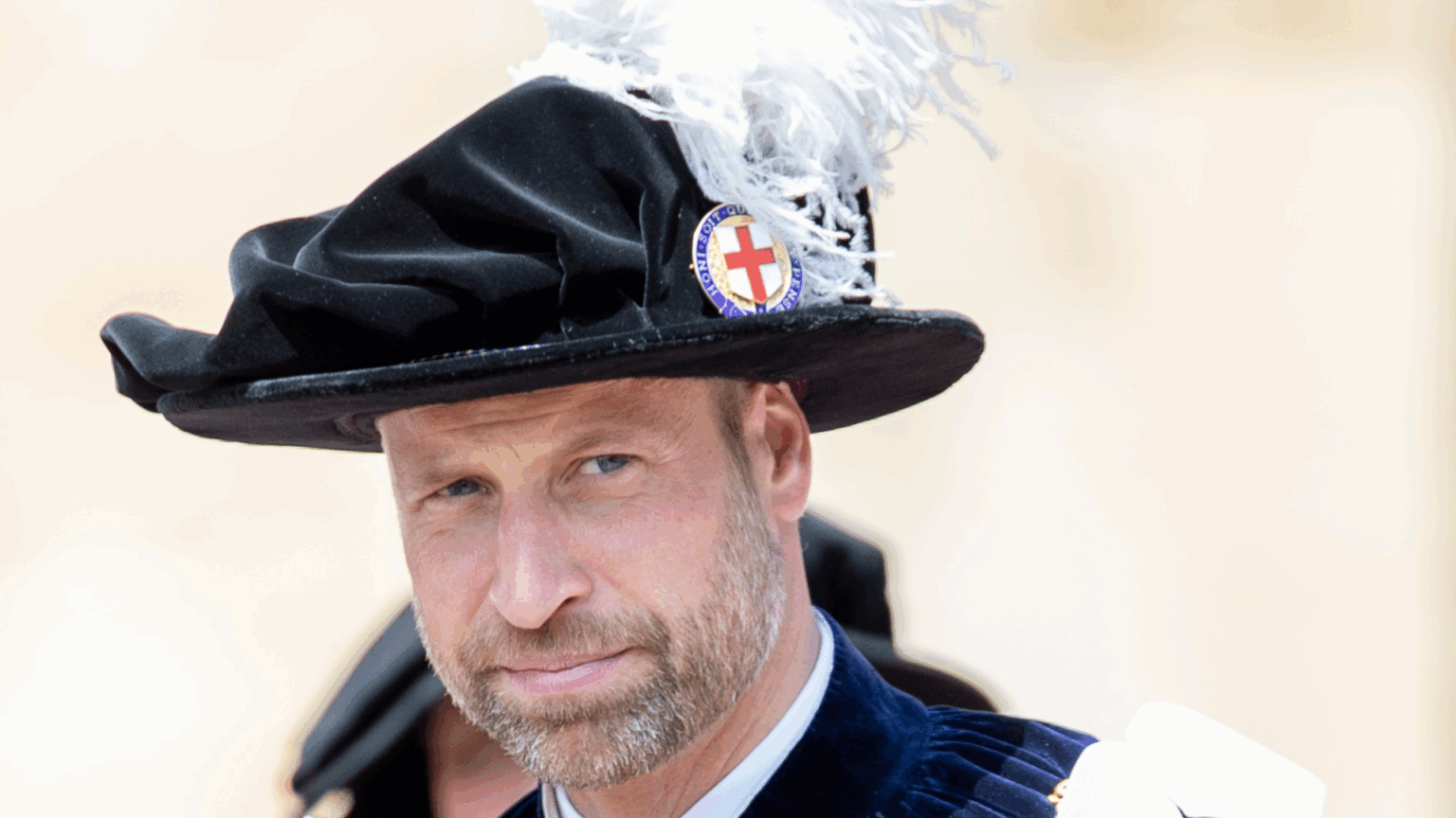 Royal Author Says Prince William Finds One Royal Tradition “Slightly Embarrassing” and “Ridiculous” Prince William wearing a plumed hat and a cape