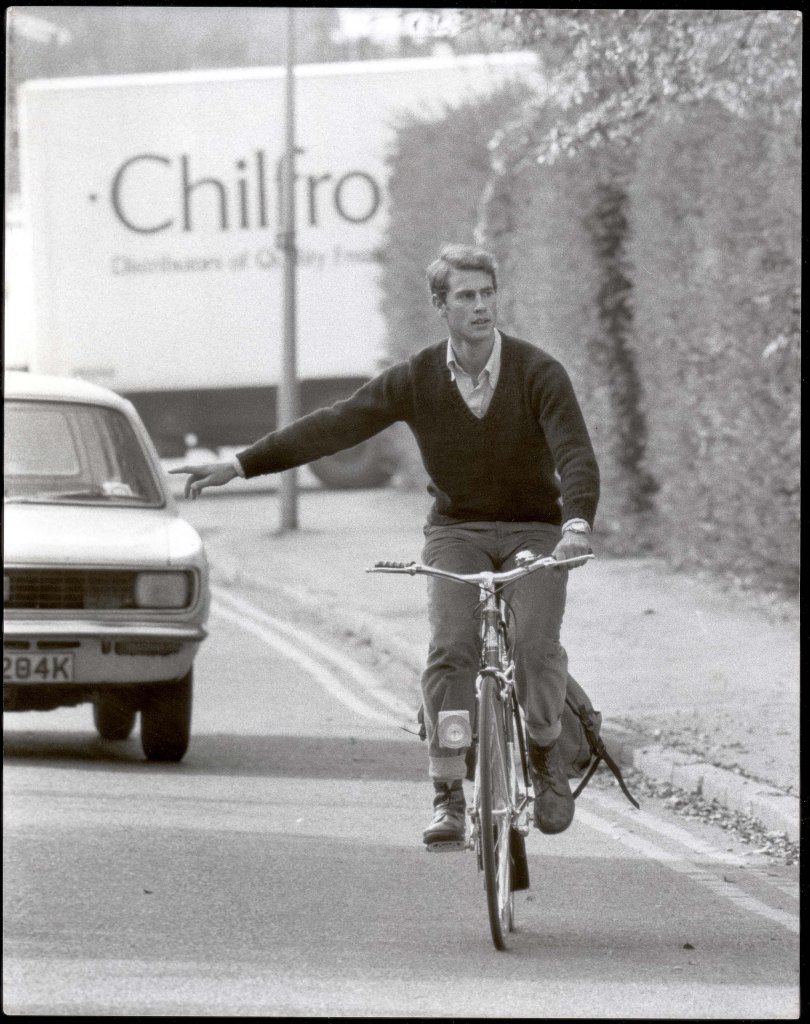 Prince Edward cycling to Cambridge University in 1983