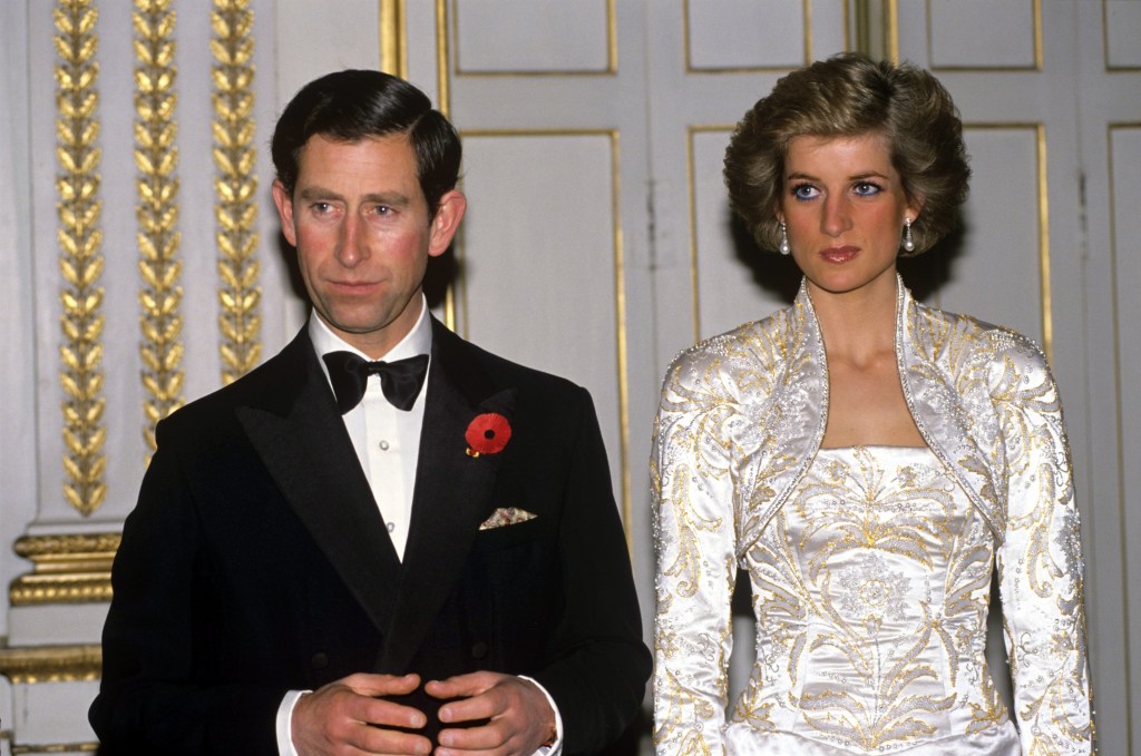 Prince Charles frowning beside Princess Diana 