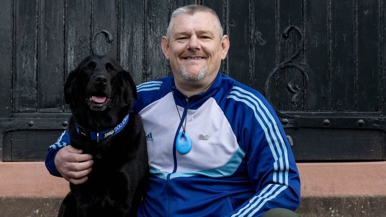 John Davidson MBE, with his black Labrador Suki. Pic: Graeme Hunter