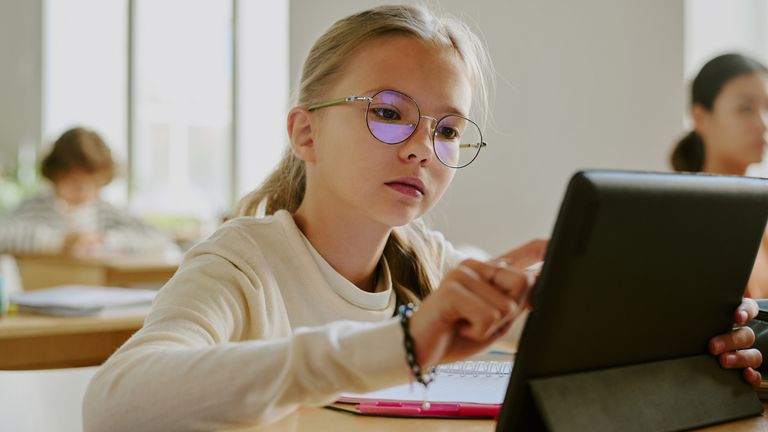 A girl using a tablet in school. Pic: iStock