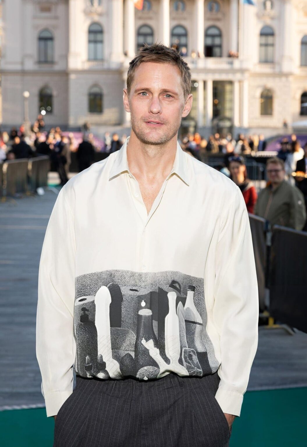 Alexander Skarsgård wore a shirt from Magliano Spring 2025, which features dildos, lube & a butt plug, at the premiere of his upcoming BDSM-themed rom-com 'Pillion' during the 21st Zurich Film Festival. Styled by Harry Lambert. (October 1, 2025)