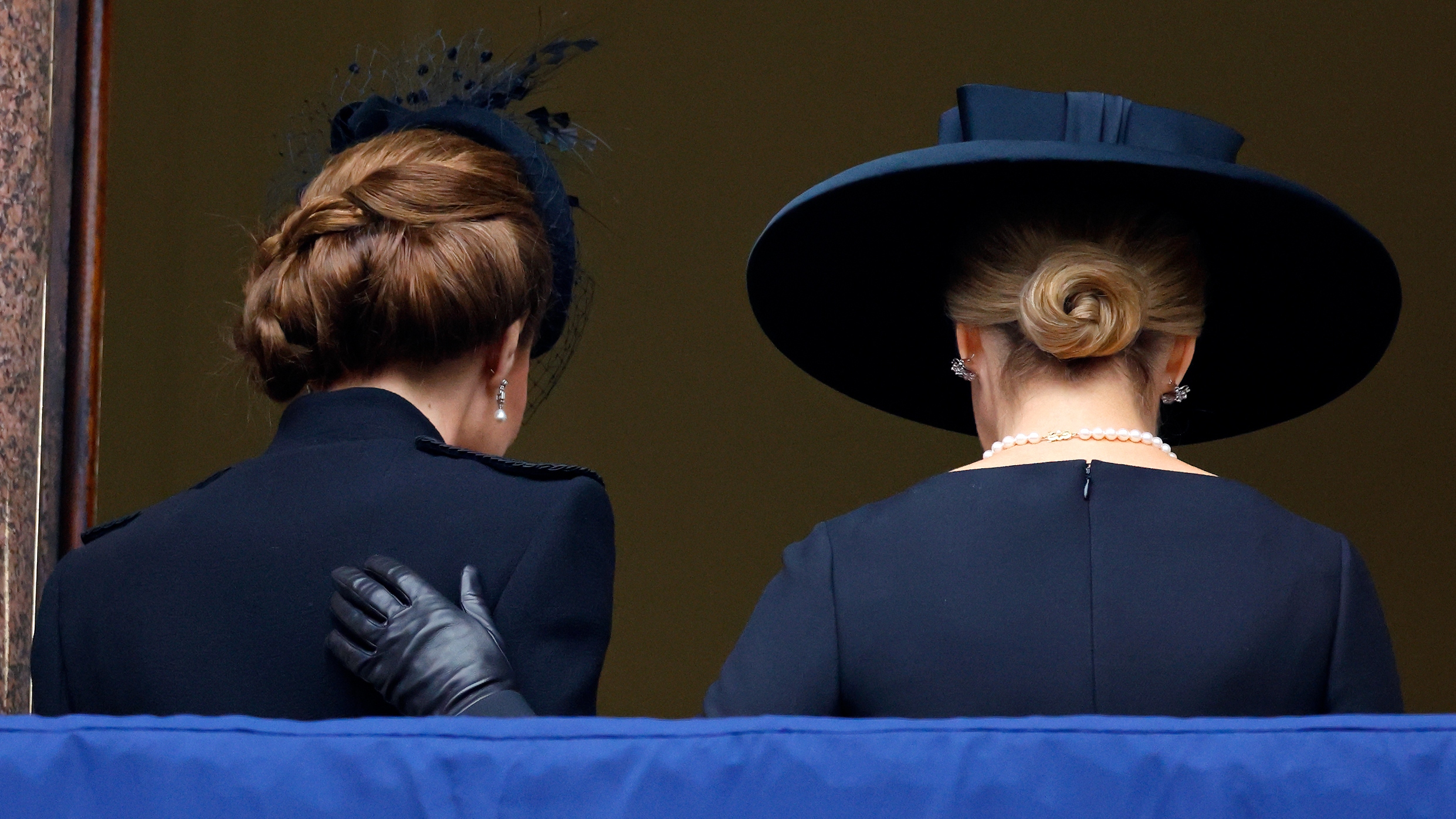 Sophie, Duchess of Edinburgh puts her hand on Kate Middleton's back as they go inside after attending the annual National Service of Remembrance at The Cenotaph on November 10, 2024